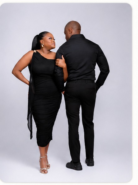 Nancy and Tebogo dressed in black, holding a bouquet of roses